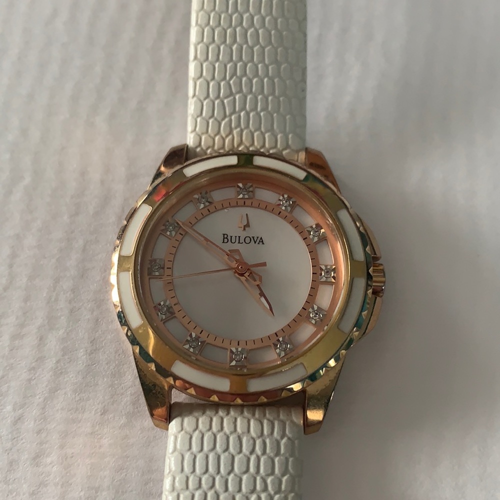 Bulova rise gold and white leather watch
